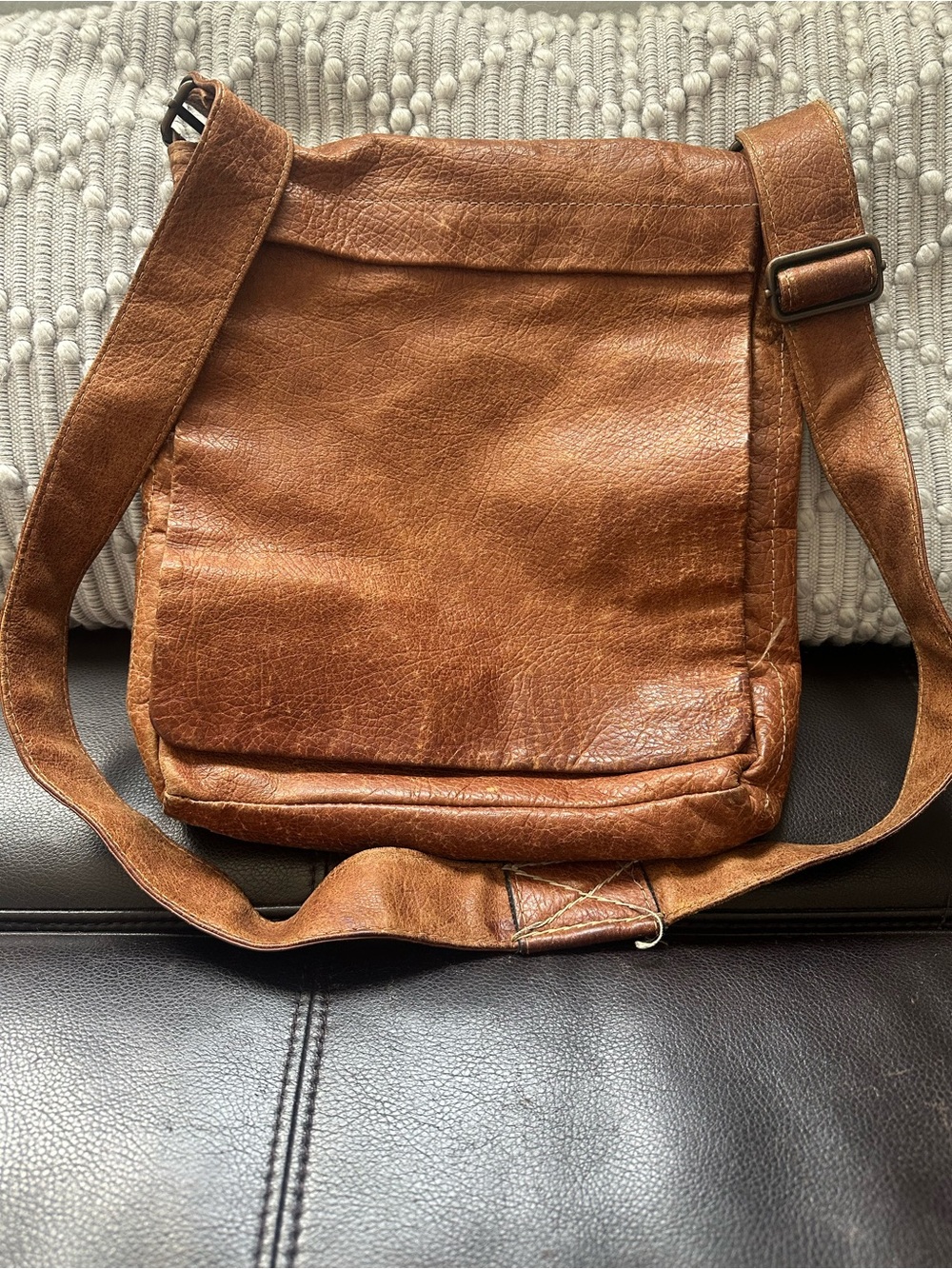 Distressed brown leather crossbody messenger bag